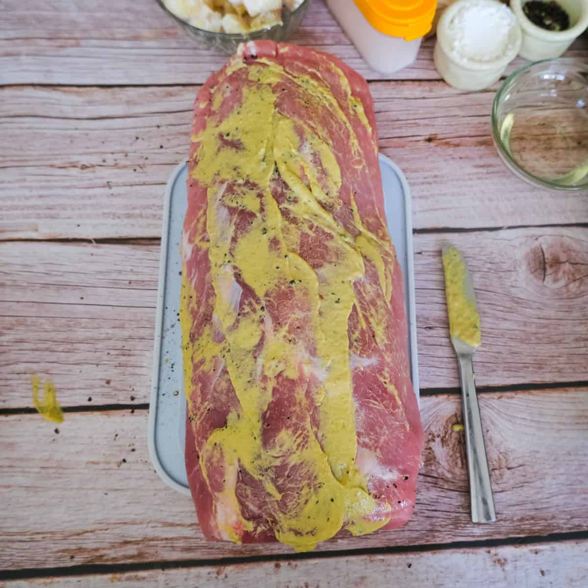 pork loin covered in mustard