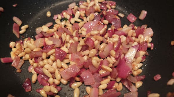 frying onions and pine nuts