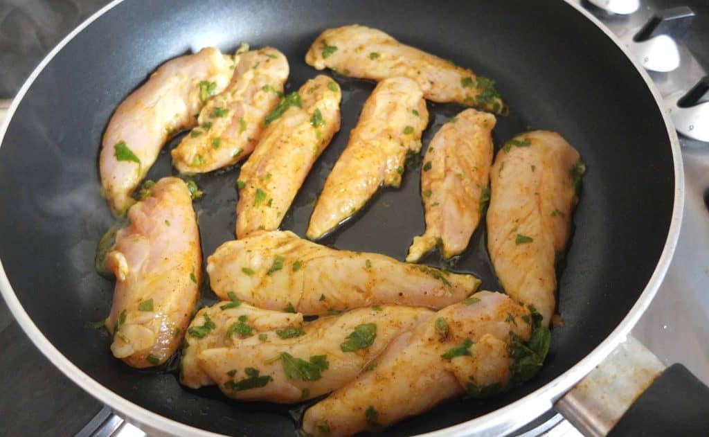 Lebanese chicken marinated frying in a pan