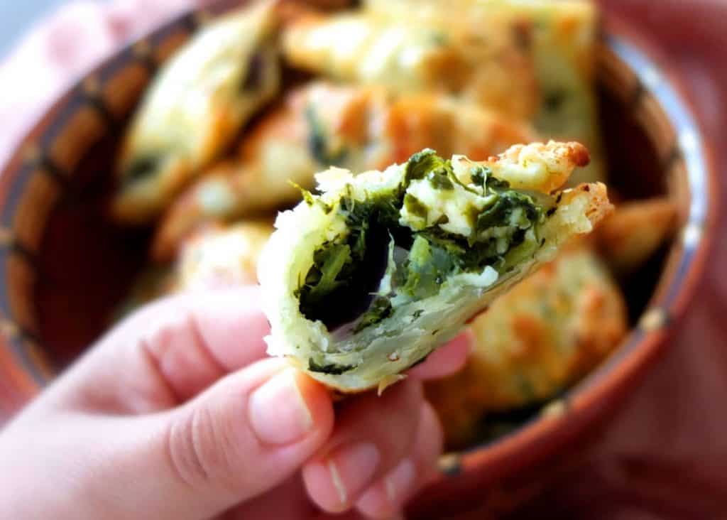 A bite of a spinach and feta parcel