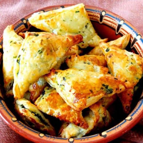 A bowl pf spinach and feta parcels