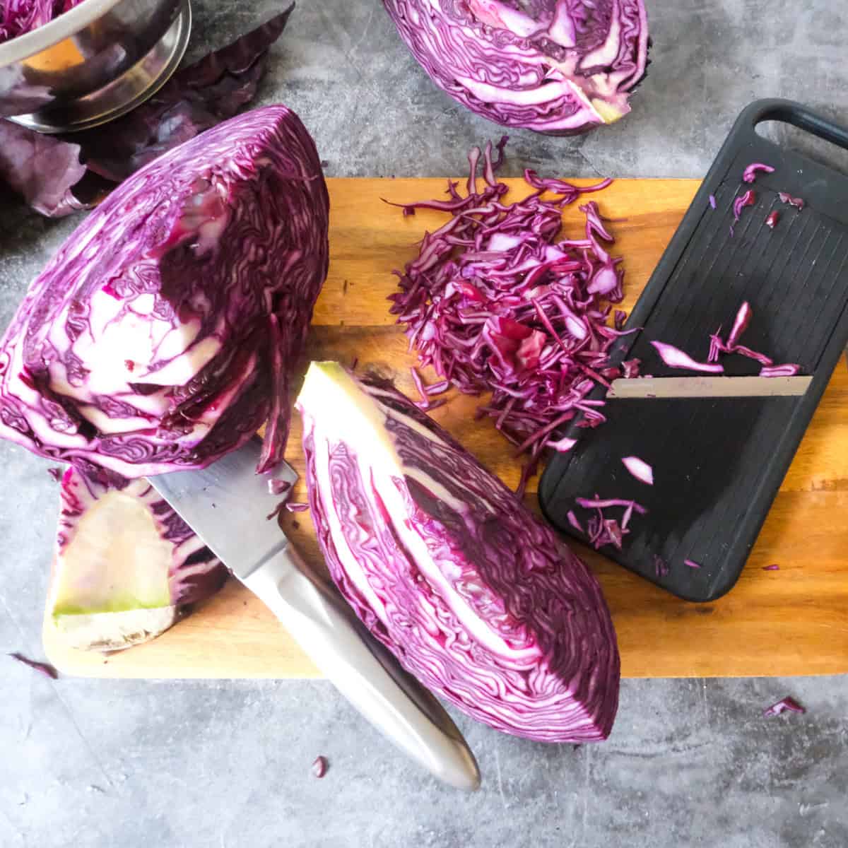 Showing how to core and slice red cabbage.