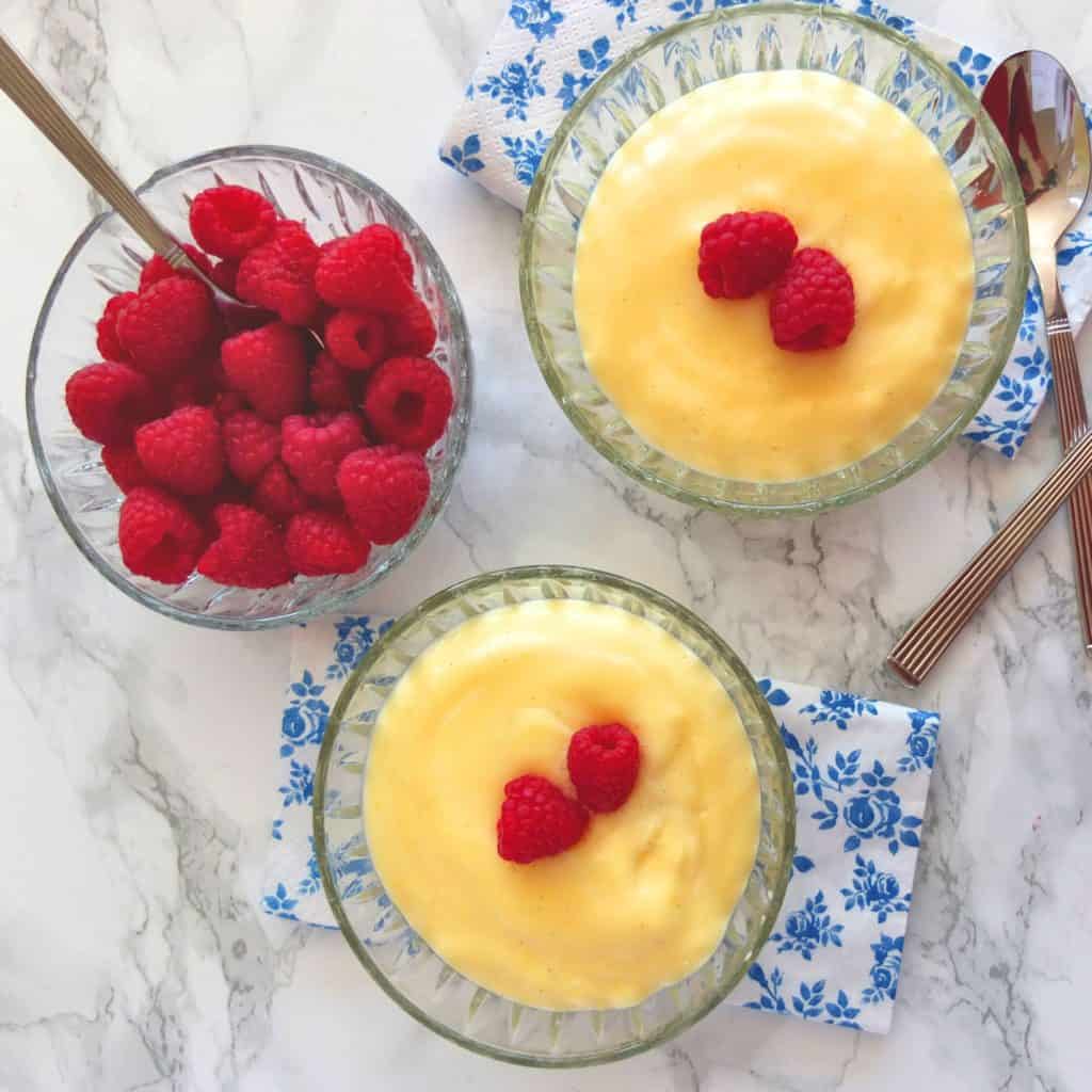 Bowls of pudding with rasberries 