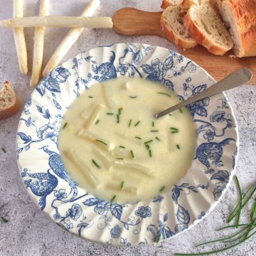 Bowl of White asparagus Soup with chives