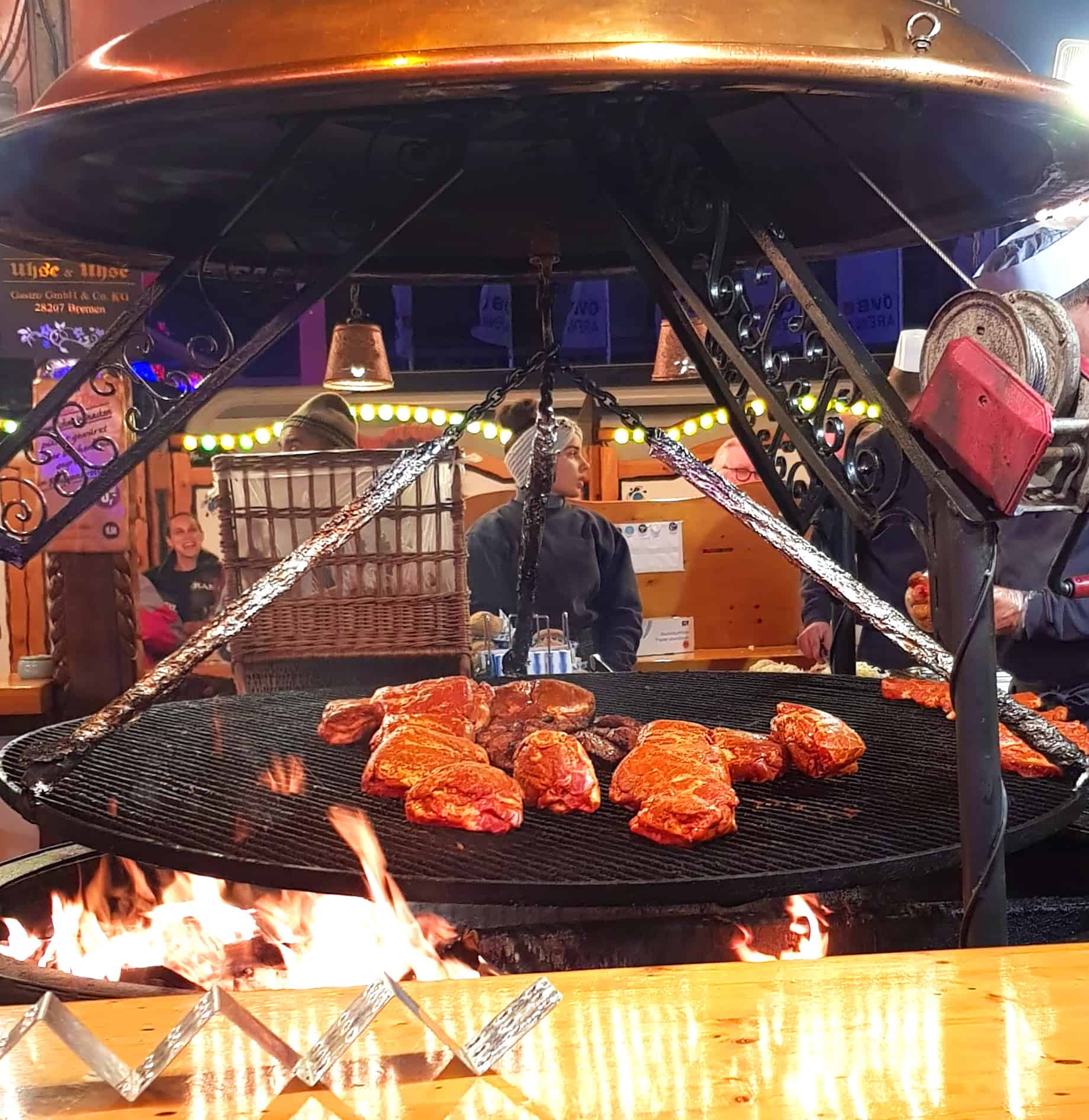 A large Schenkgrill with Schwenbraten Steaks at a German Christmas Market