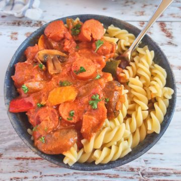 Sausage Goulash with Pasta in a blue bowl.