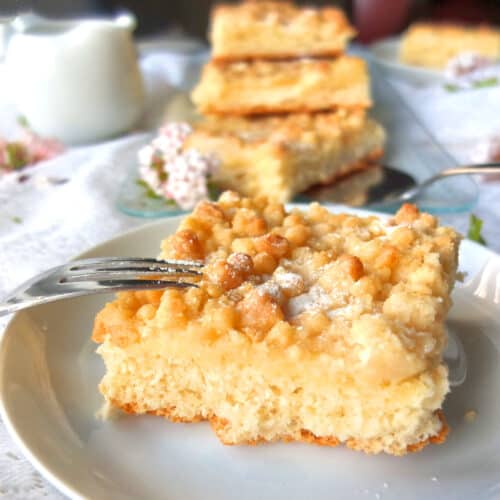 A piece of German streusel cake on a plate.