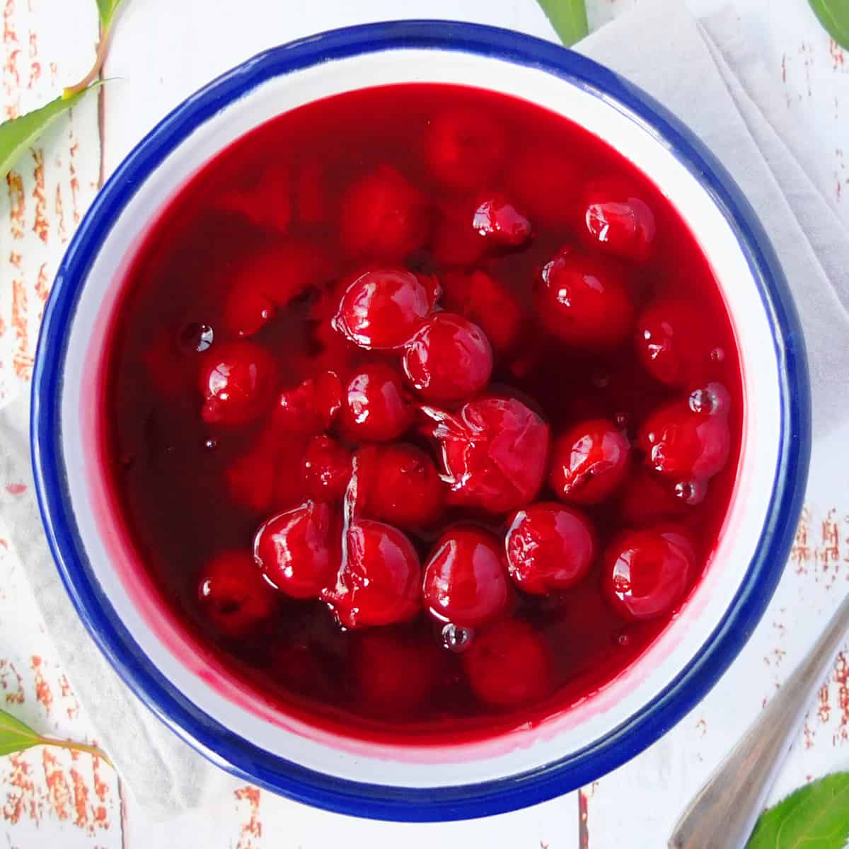 cherry sauce in a blue and white bowl.