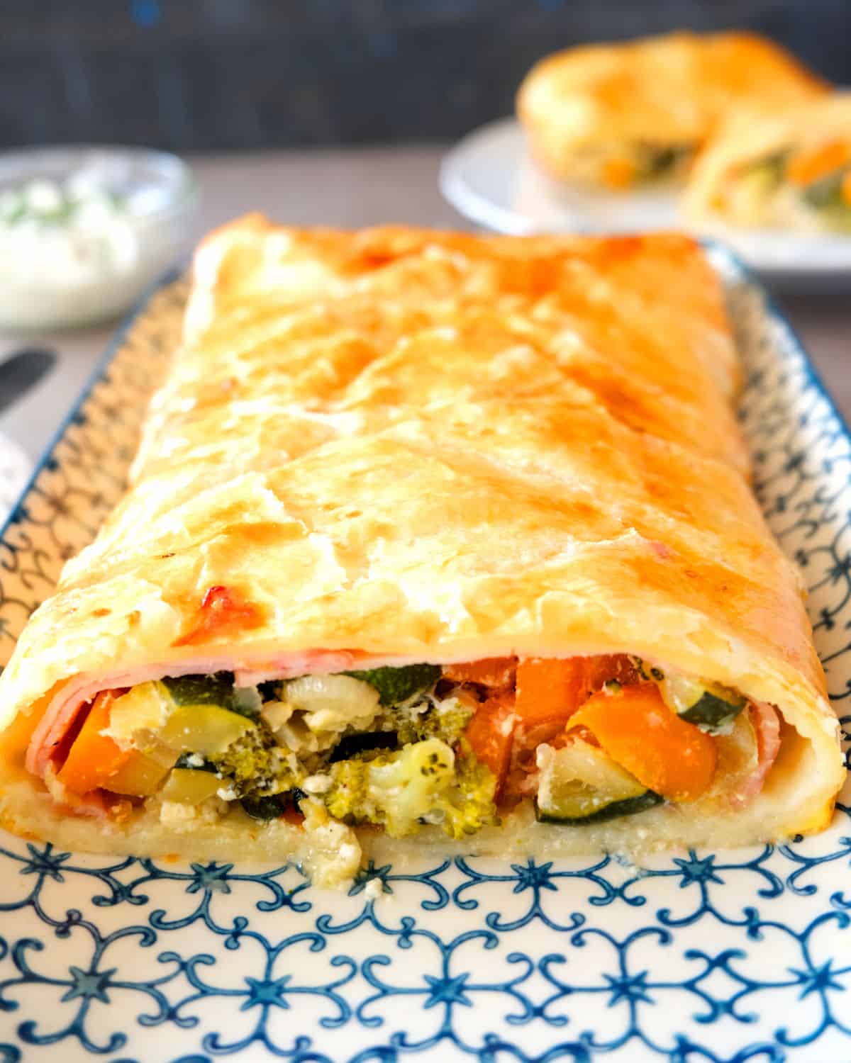 a cut open strudel with vegetables