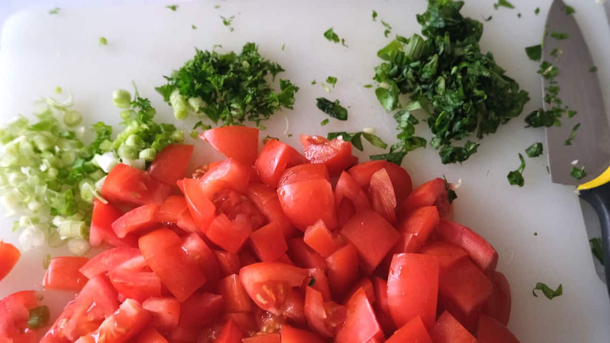 chopped ingredients for tomato salad.