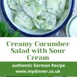 German Cucumber Salad in a blue and white bowl with sour cream.
