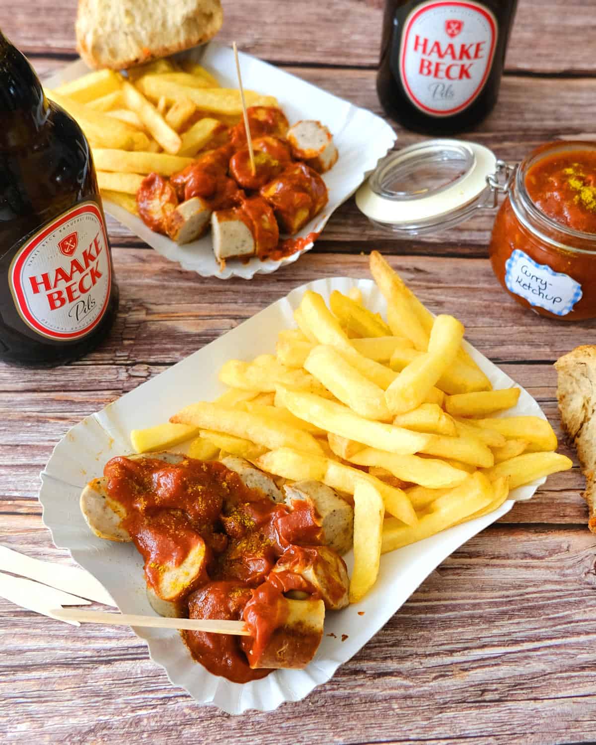 Beer and currywurst with fries and homemade currywurst sauce