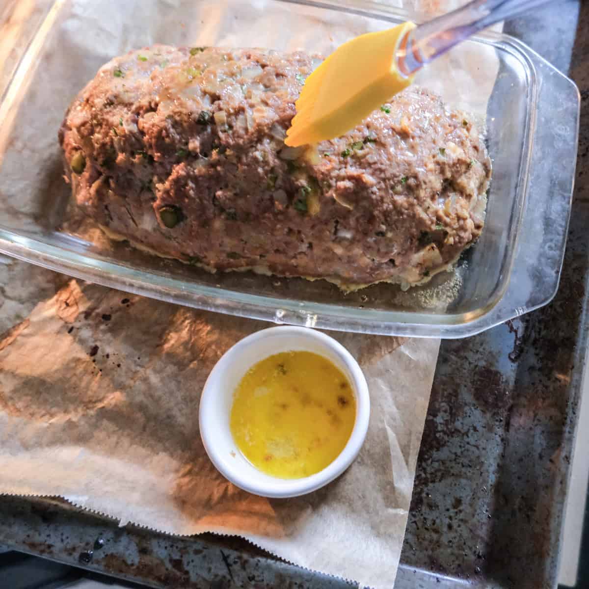brushing the meatloaf to butter to make the outside brown