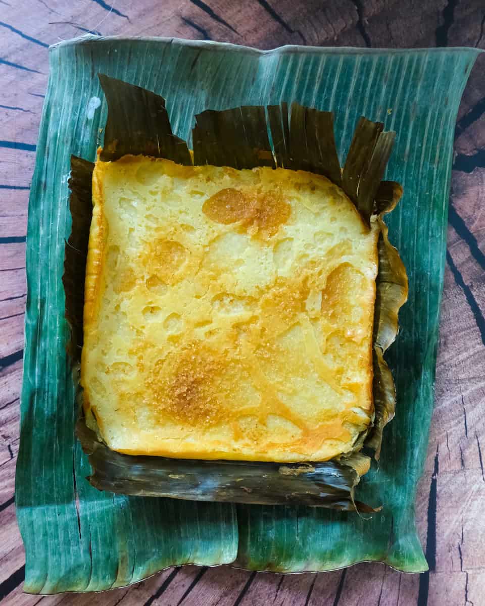Baked bibinka in a banana leaf