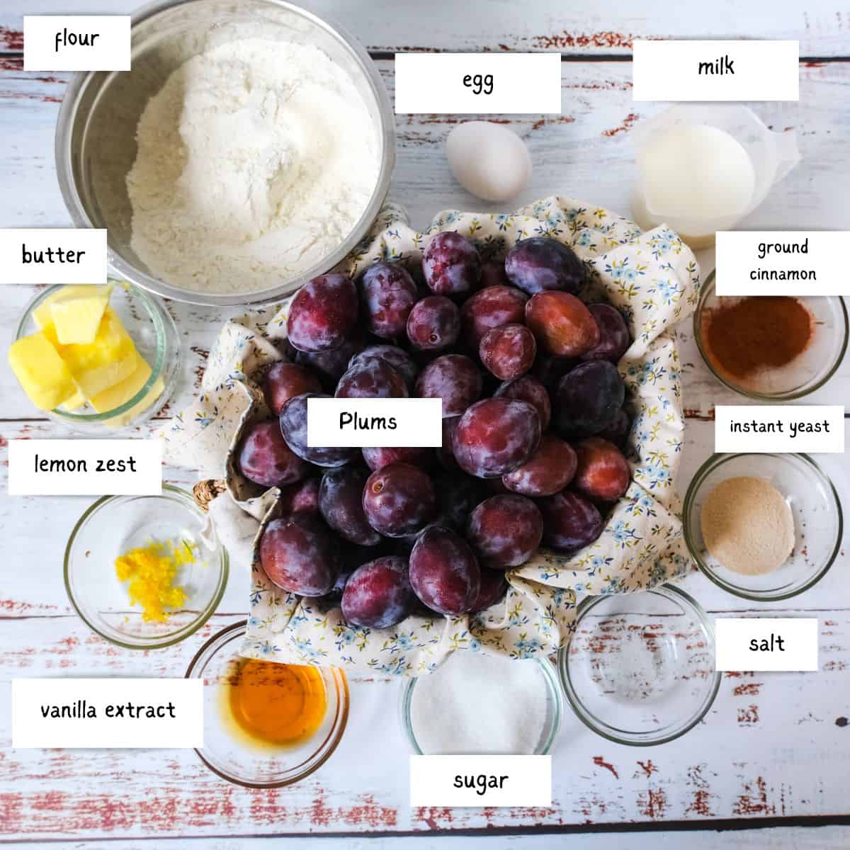 German Plum Cake Ingredients: flour, egg, milk, butter, lemon zest, plums, ground cinnamon, yeast, salt, sugar and vanilla extract.