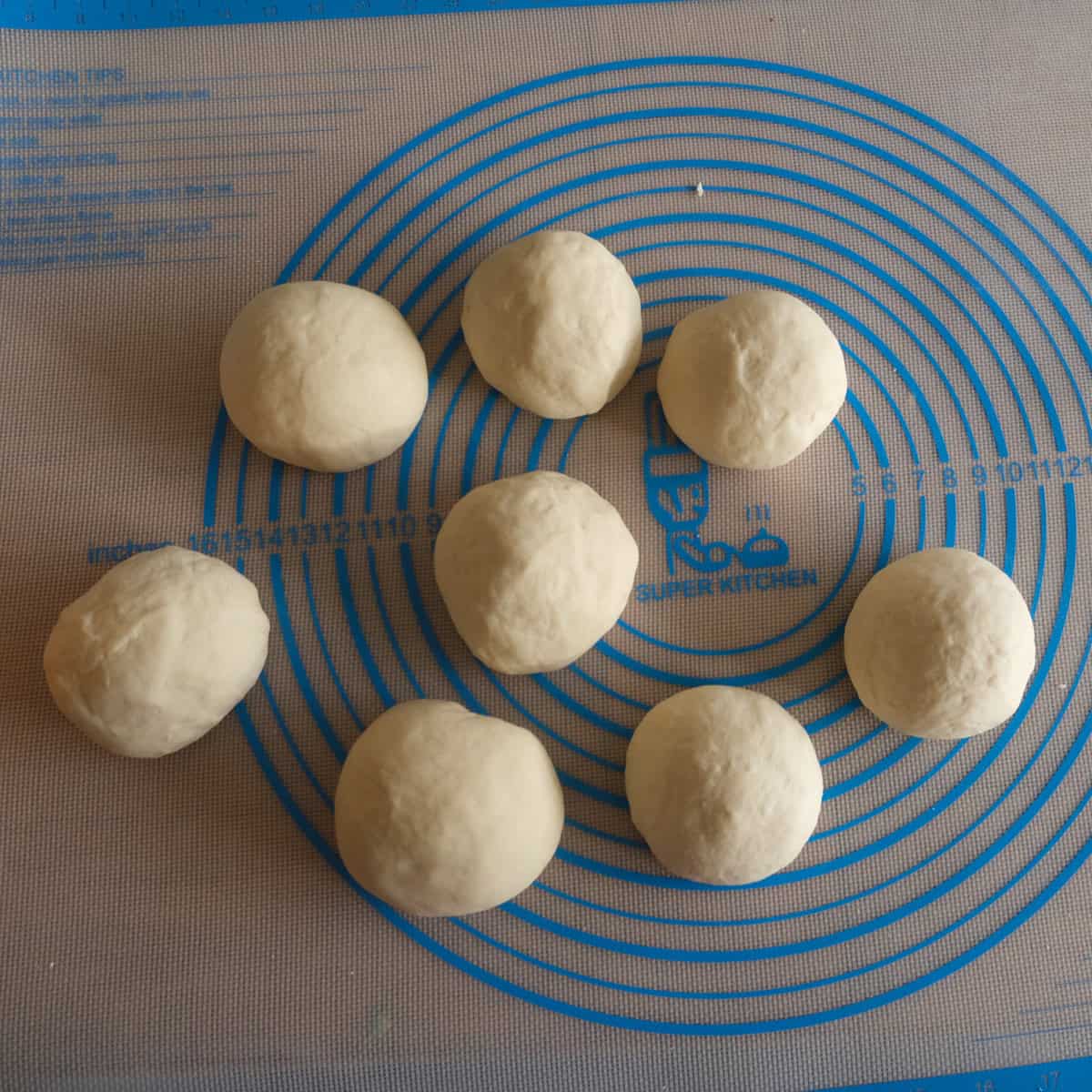 formed unbaked pretzel buns.