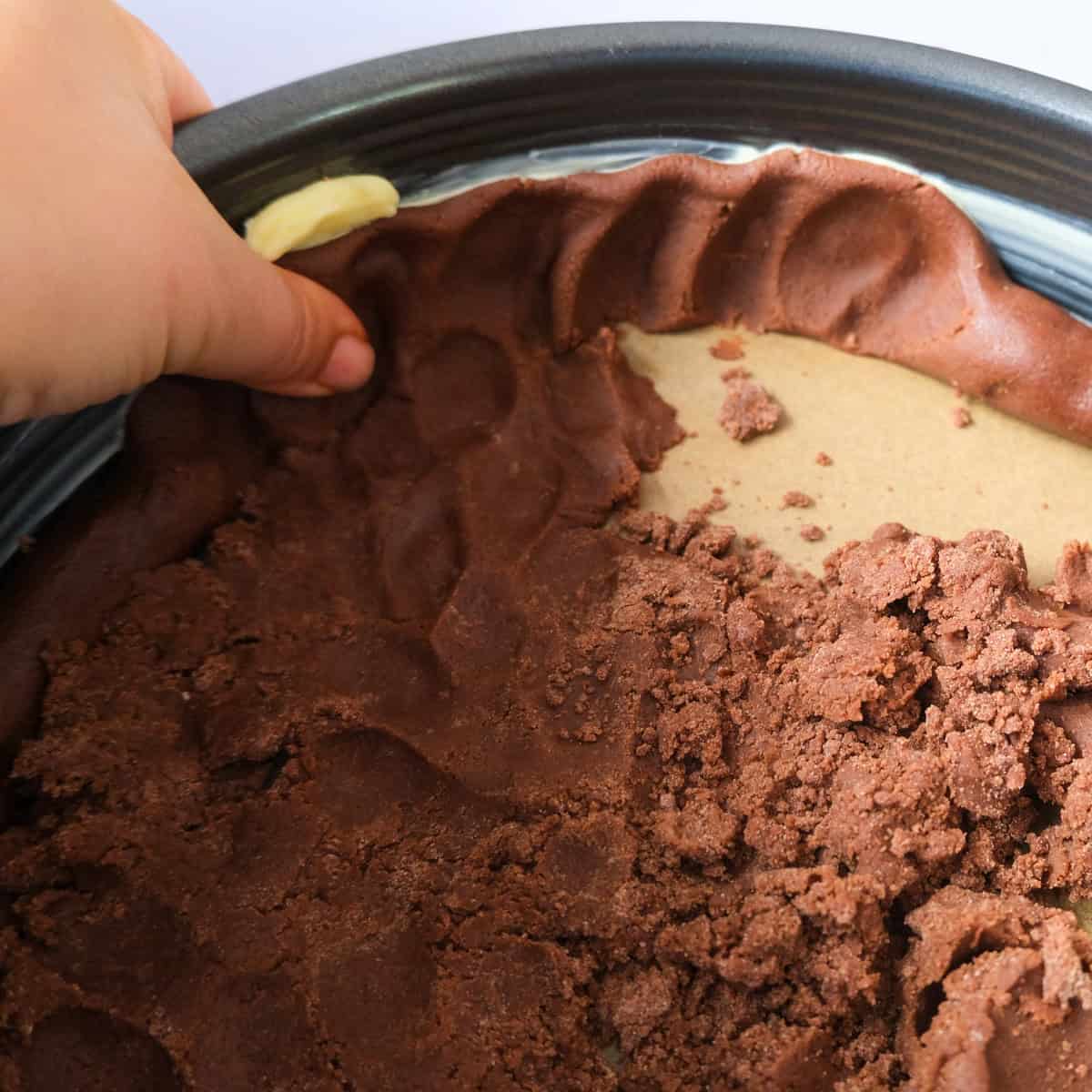 chocolate cheesecake crust in spring form.