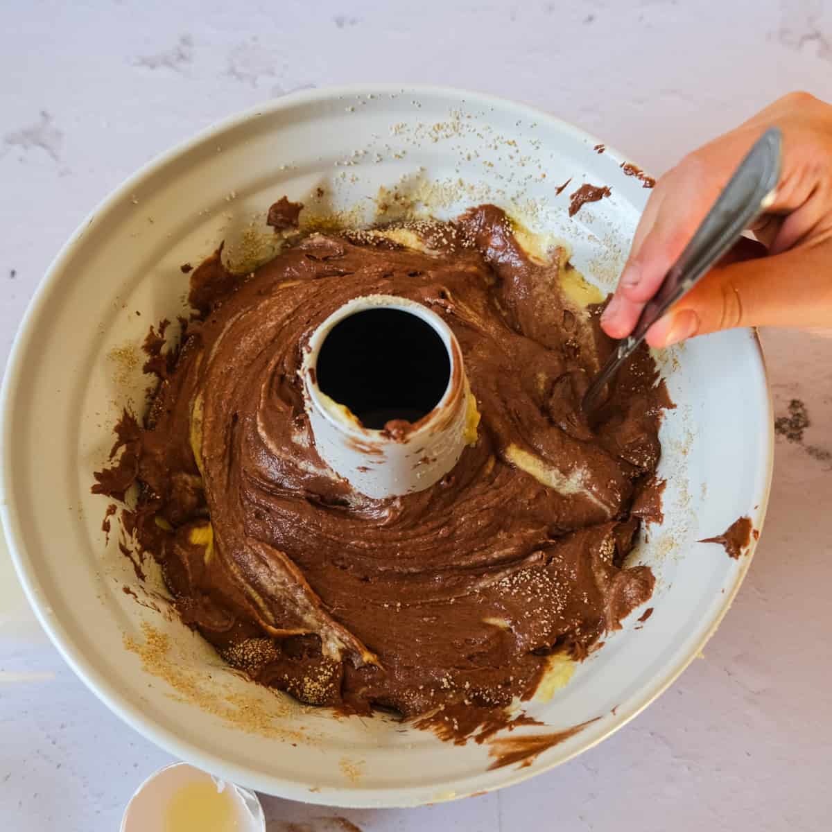 marbling the cake with a fork.