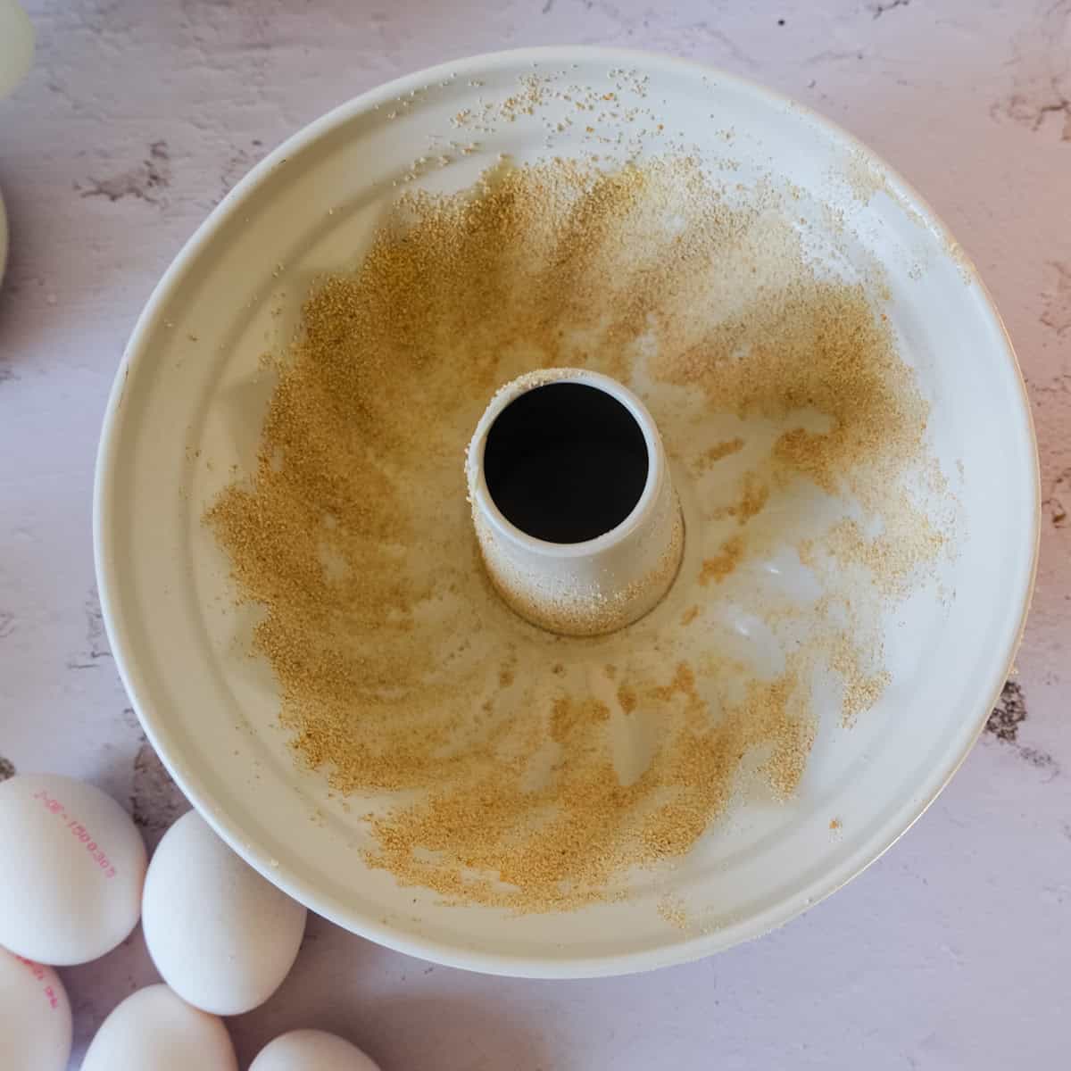 bundt form greased and layed out with bread crumbs