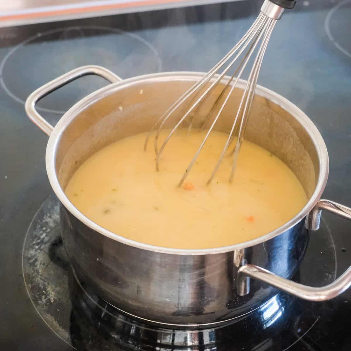 making the creamy sauce for vegetable gratin