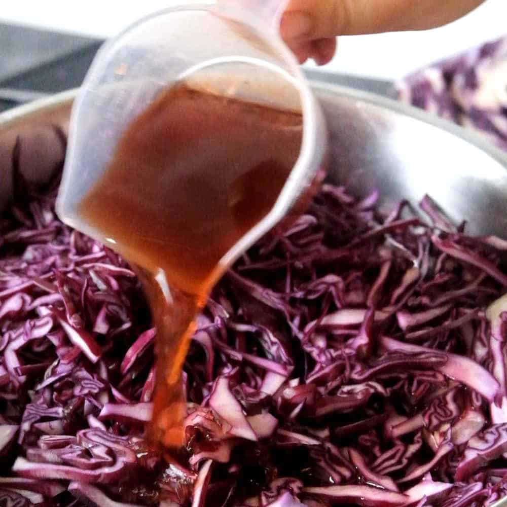 pouring vinegar over red cabbage