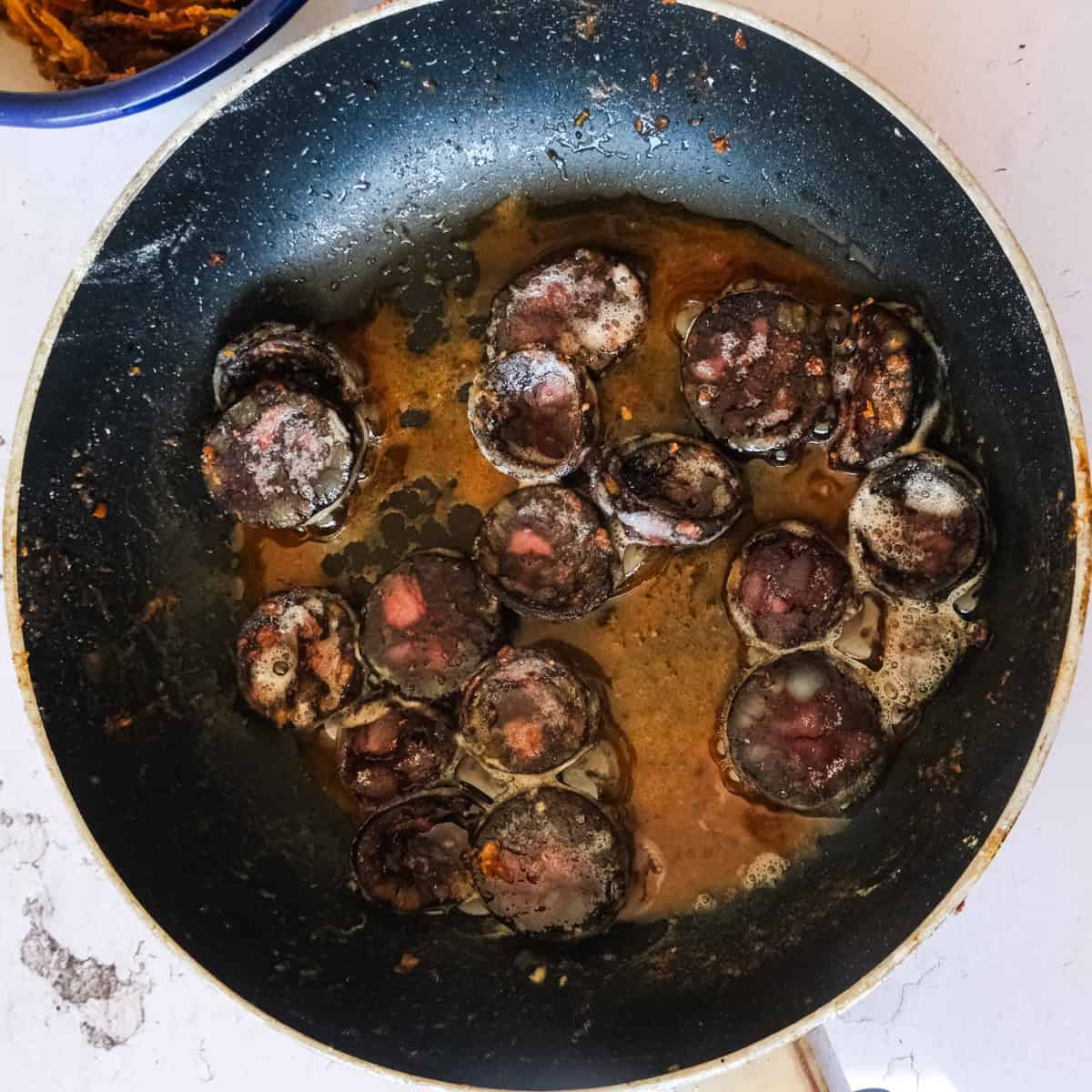 German black Pudding in a saucepan.