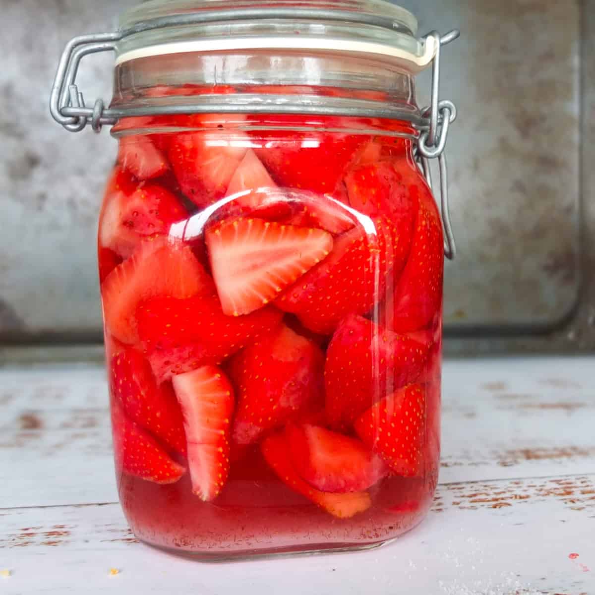 Strawberries and vodka in the jar (fresh/full)