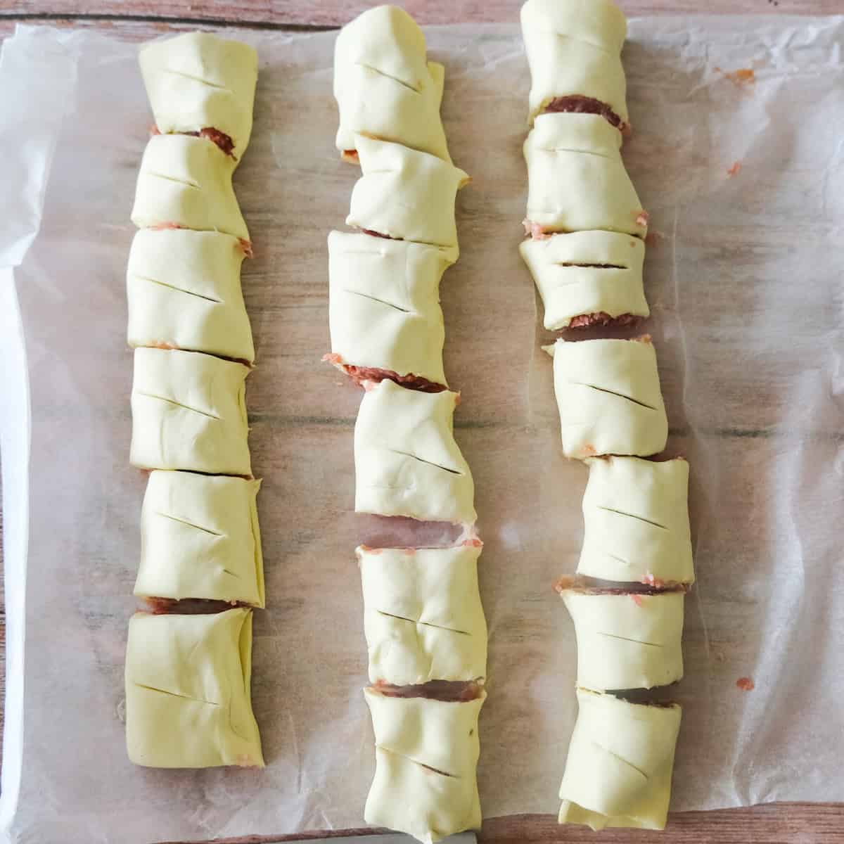 rolling sausage rolls.