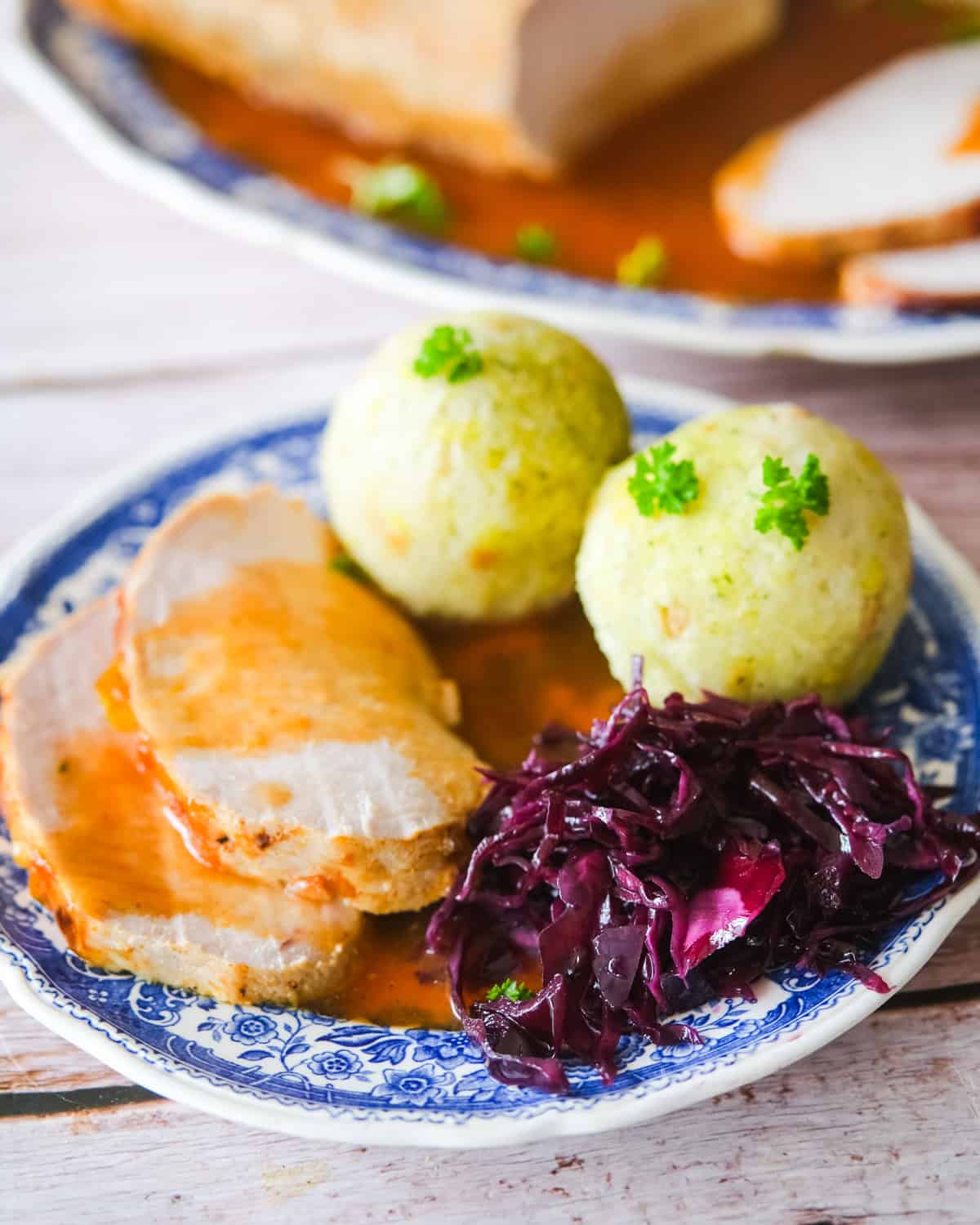 German schweinebraten with bread dumplings and red cabbage