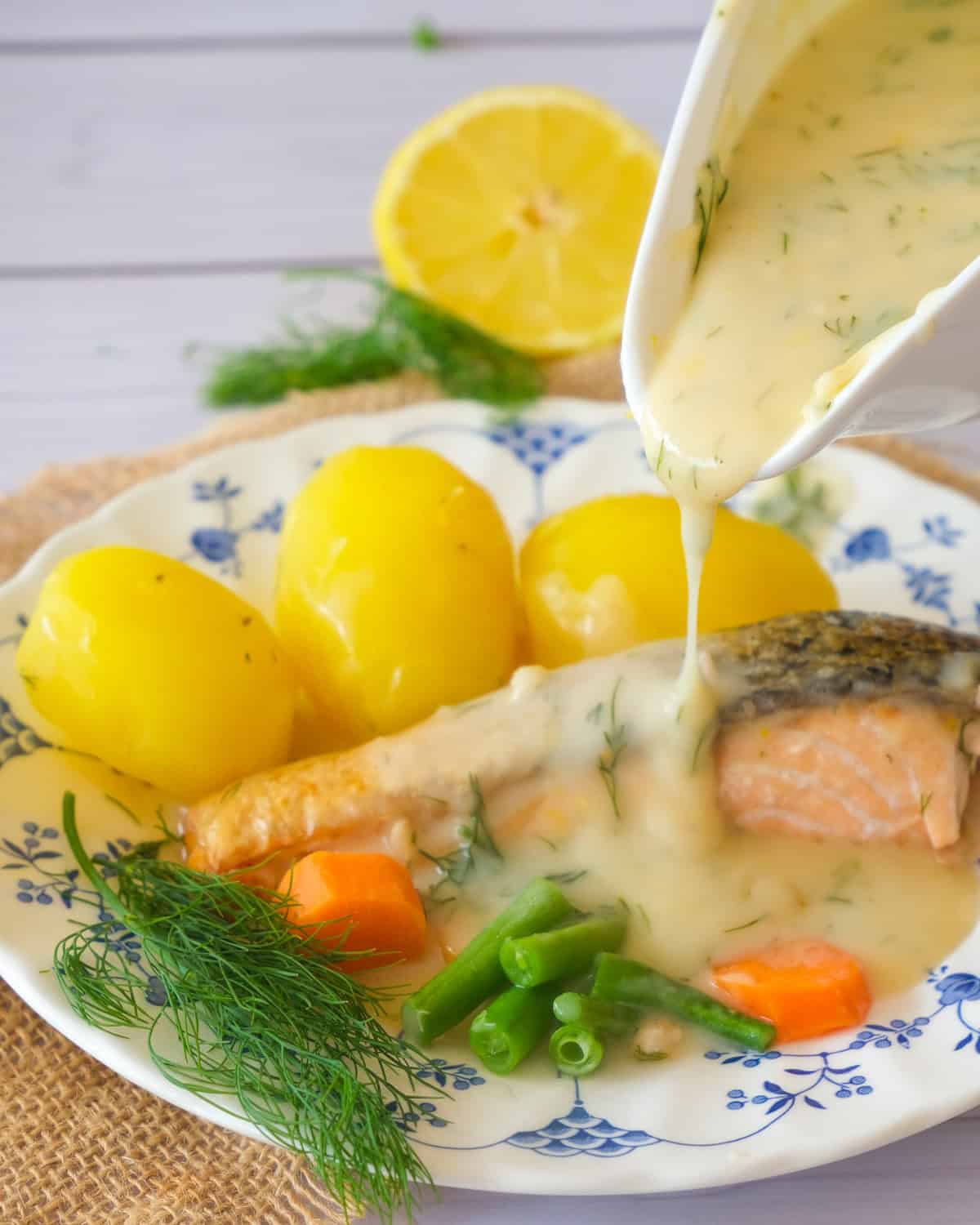 a creamy lemony dill sauce poured over salmon